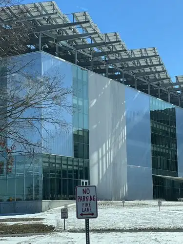 Sleek glass and solar power in a winter landscape.